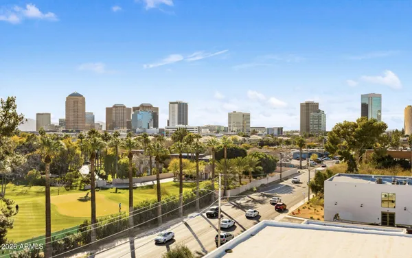 a view of a patio with a table and chairs