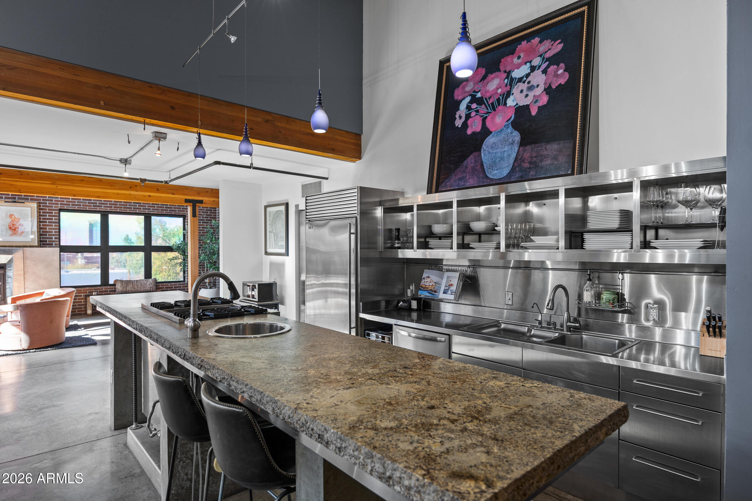 914 East Osborn Road, Unit 403 Phoenix, AZ 85014 - Photo 6 of 49 a kitchen with stainless steel appliances granite countertop a sink and a counter top space