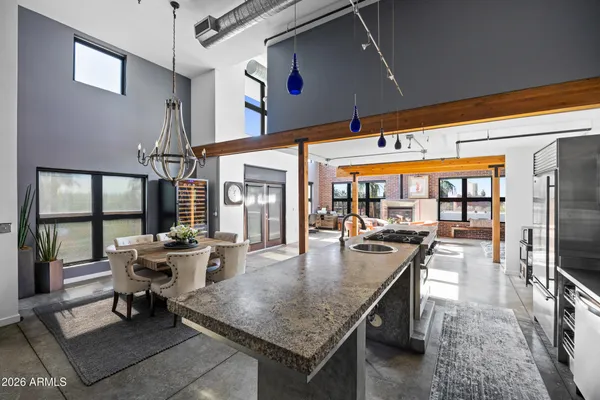 a dining hall with dining table and chairs