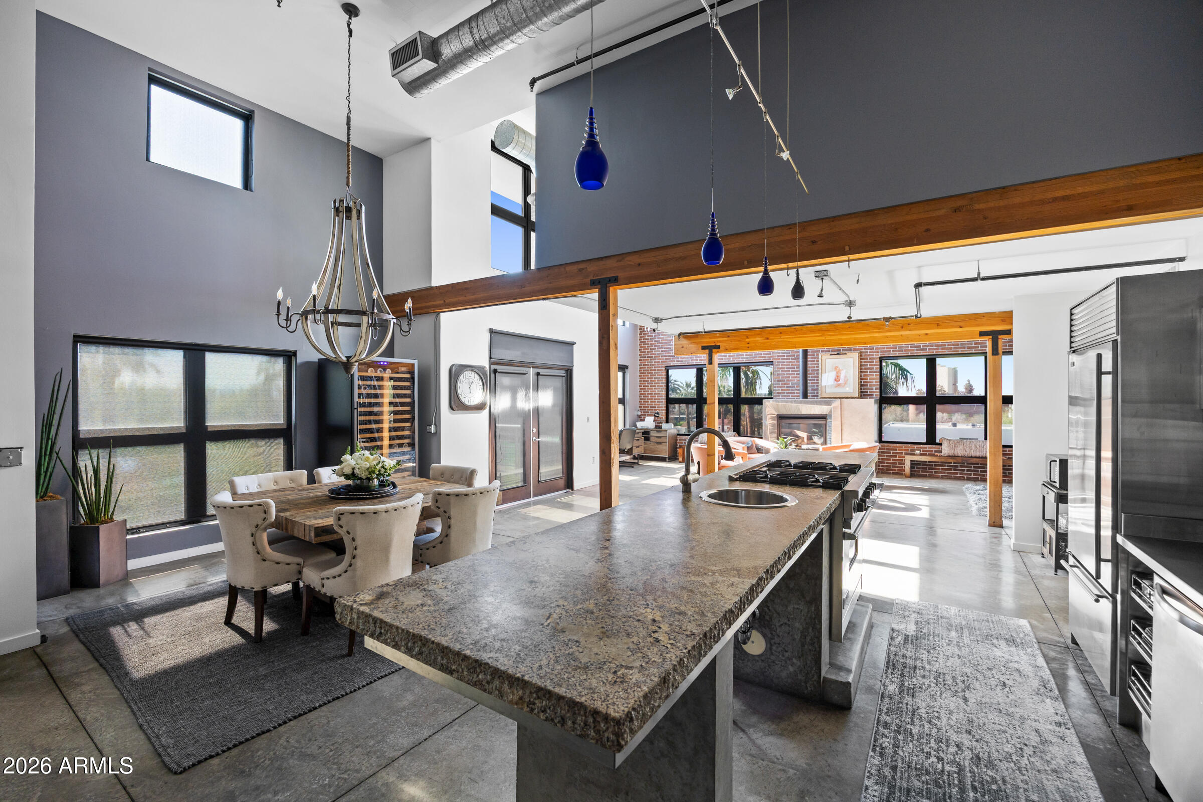 914 East Osborn Road, Unit 403 Phoenix, AZ 85014 - Photo 10 of 49 a dining hall with dining table and chairs