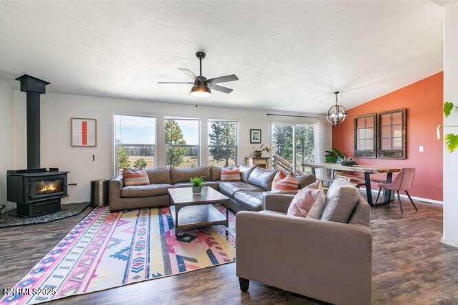 1015 Mountain Quail Road Calpine, CA 96124 - Photo 12 of 34 a living room with furniture ceiling fan and a rug