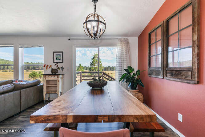 1015 Mountain Quail Road Calpine, CA 96124 - Photo 18 of 34 a view of a dining room with furniture a chandelier and wooden floor