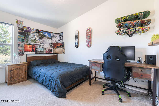 1015 Mountain Quail Road Calpine, CA 96124 - Photo 19 of 34 a bedroom with a workspace