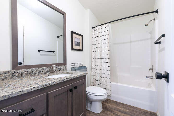 1015 Mountain Quail Road Calpine, CA 96124 - Photo 20 of 34 a bathroom with a granite countertop sink toilet and shower