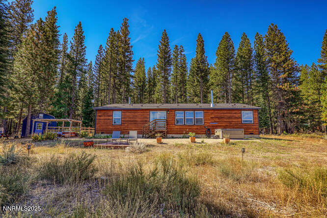 1015 Mountain Quail Road Calpine, CA 96124 - Photo 3 of 34 a view of a house with swimming pool and yard