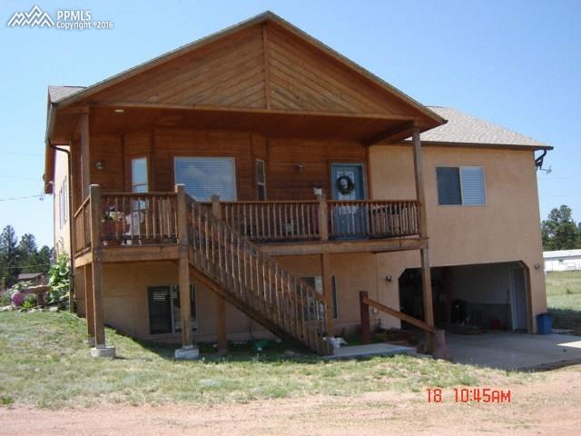 435 Due S Road Florissant, CO 80816 - Photo 16 of 16 Front of house from driveway. Restained after this picture.