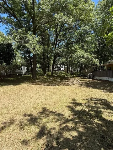 a view of swimming pool with a yard