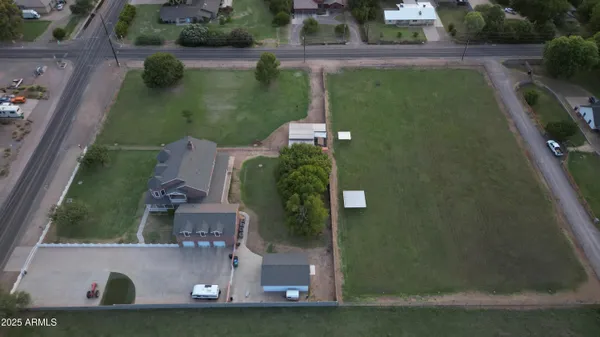 an aerial view of a residential houses with outdoor space