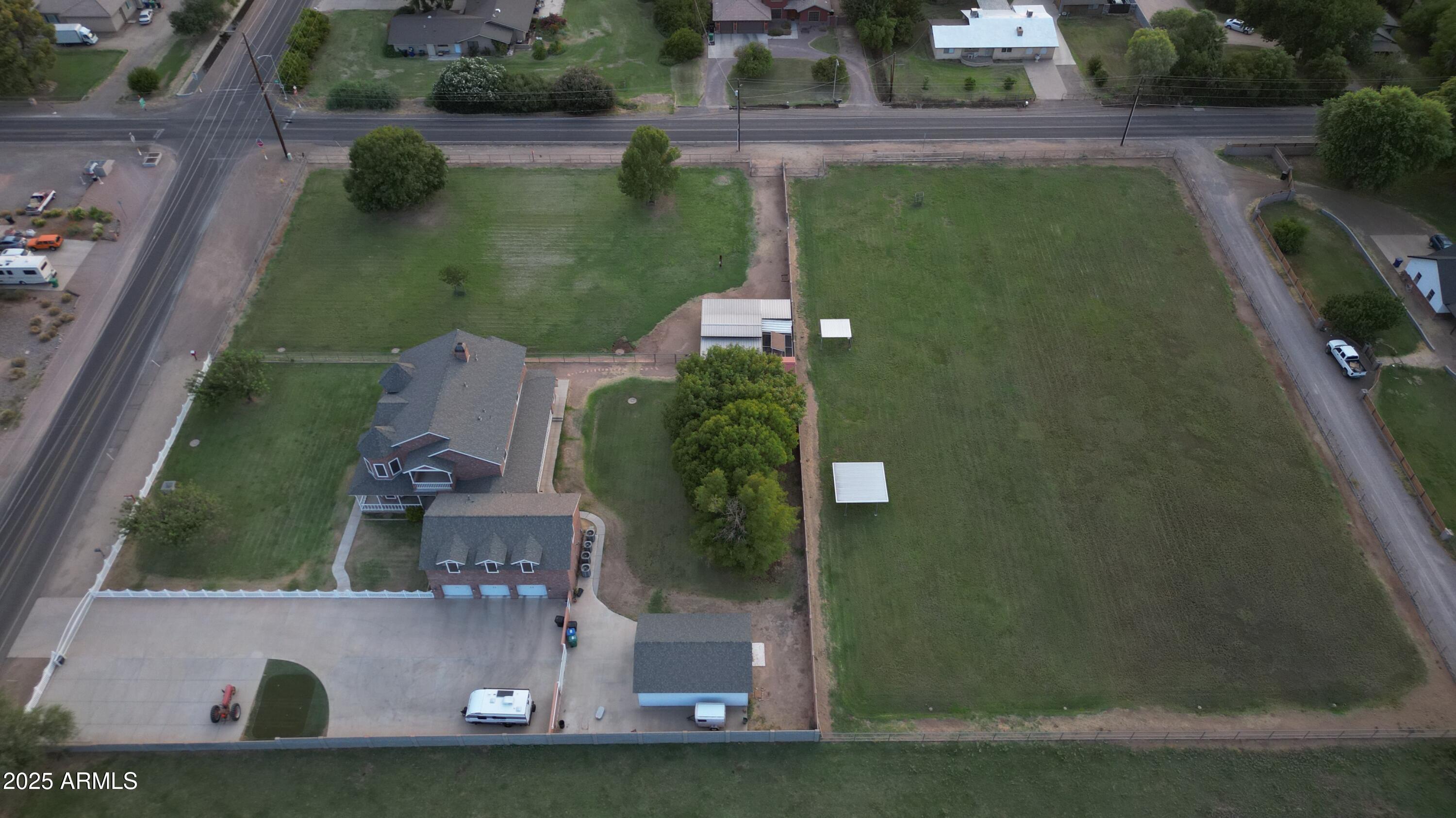 424 East Lehi Road, Unit 2 Mesa, AZ 85203 - Photo 1 of 39 an aerial view of a residential houses with outdoor space