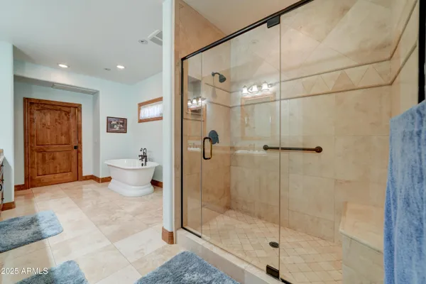 a bathroom with a shower a toilet and sink