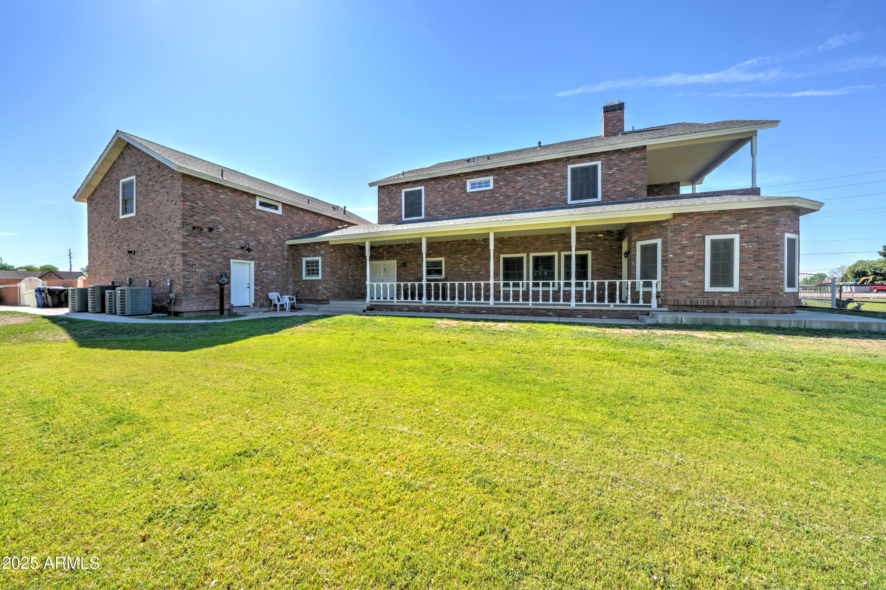 424 East Lehi Road, Unit 2 Mesa, AZ 85203 - Photo 35 of 39 a front view of a house with swimming pool