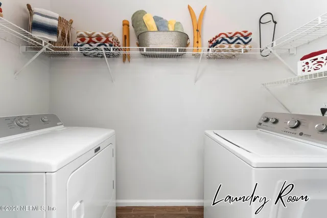a view of a hallway with washer and dryer
