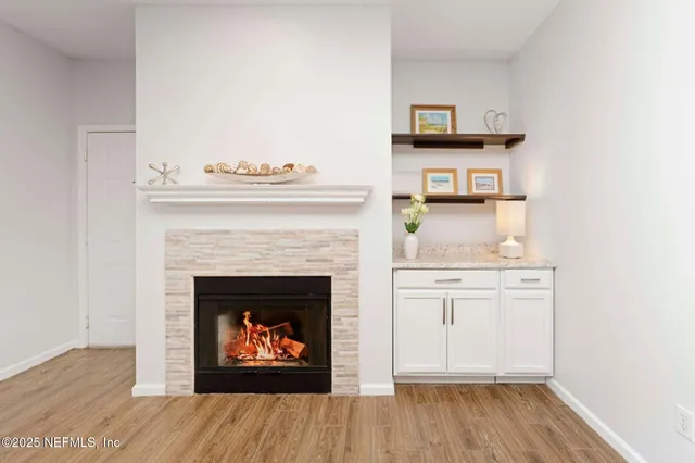a kitchen with refrigerator a sink and wooden cabinets