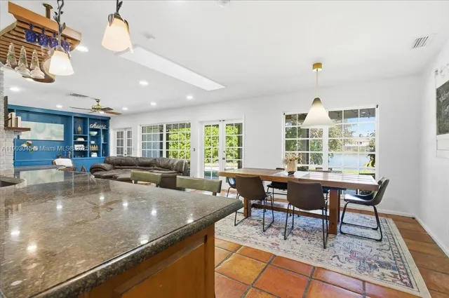 a view of a dining room kitchen with furniture and wooden floor