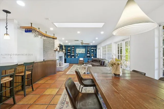 a living room with fireplace furniture and a flat screen tv