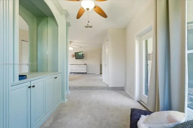 a bathroom with a double vanity sink toilet mirror and bathtub