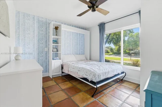 a view of house that has a swimming pool with a patio