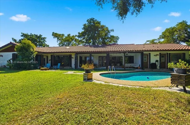 a view of house with a garden
