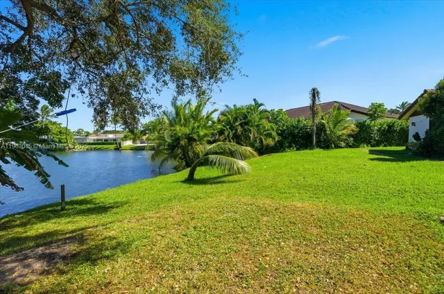 an aerial view of a houses with a yard