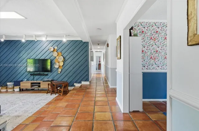 a living room with a rug and a table