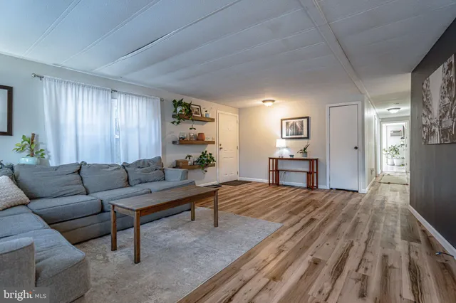 a view of a livingroom with furniture and windows