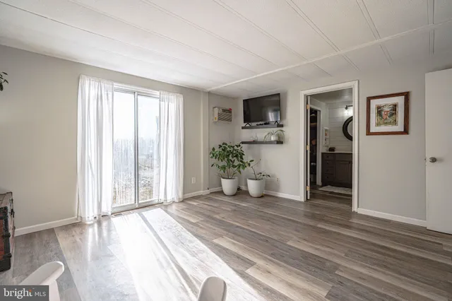 a bathroom with a toilet a sink and a mirror
