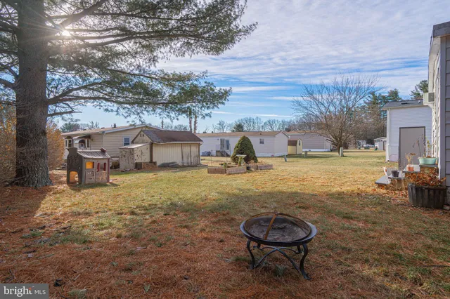 a view of a house with a yard and garage