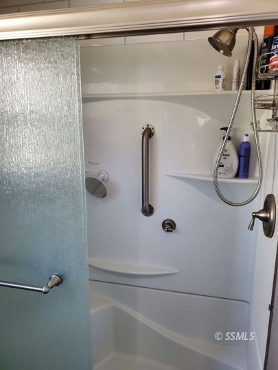 8926 Caliente Bodfish Road Caliente, CA 93518 - Photo 14 of 43 a bathroom with a shower and a mirror