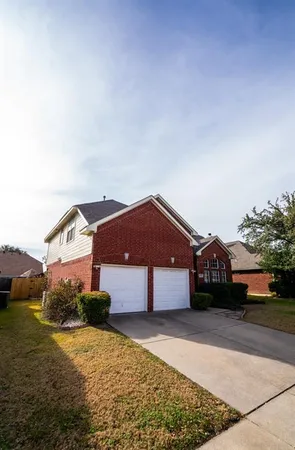 a house view with a garden space