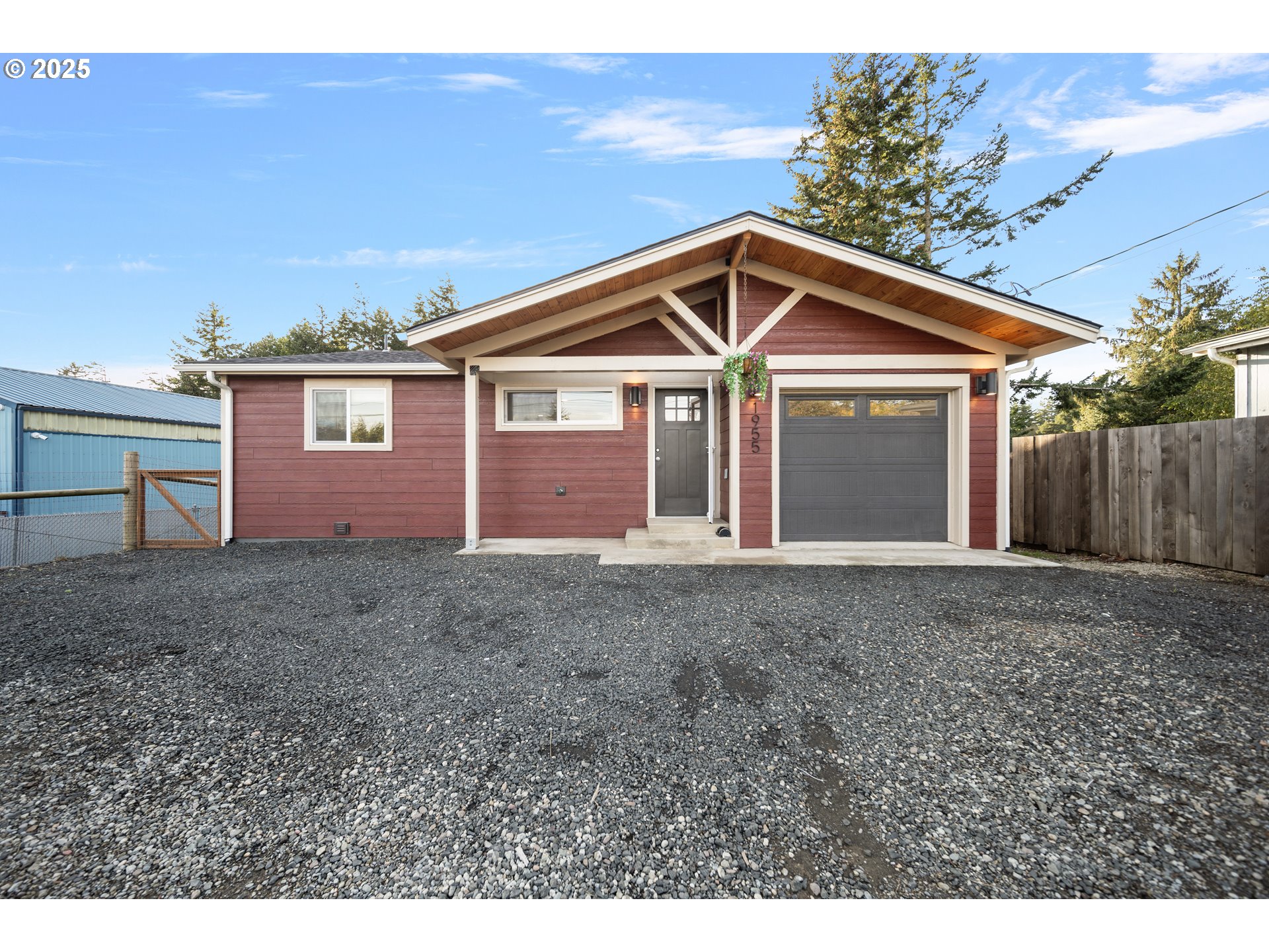 a view of a house with a yard and garage