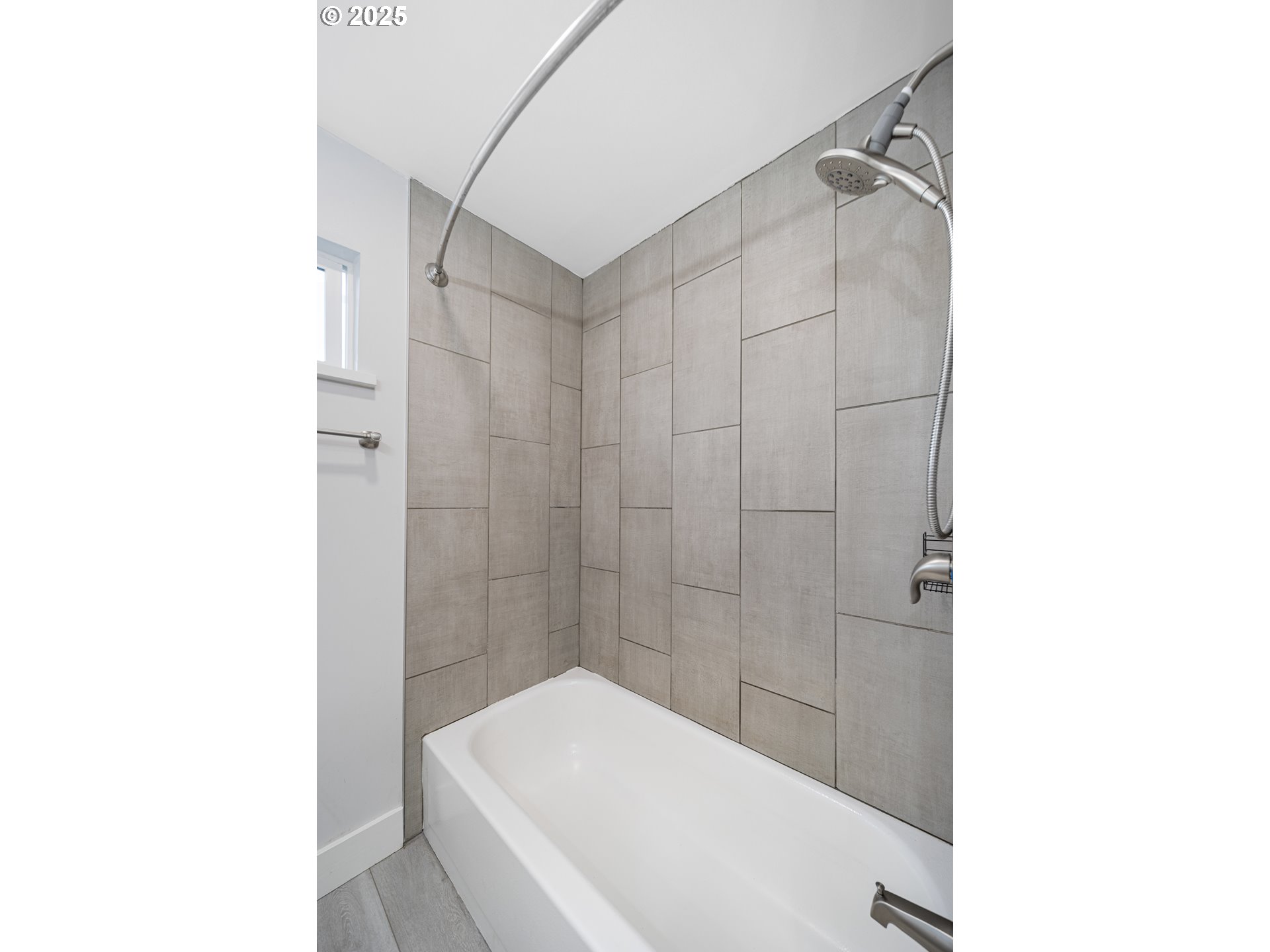 1955 28th Street Coos Bay, OR 97420 - Photo 22 of 48 a bathroom with a bathtub and shower