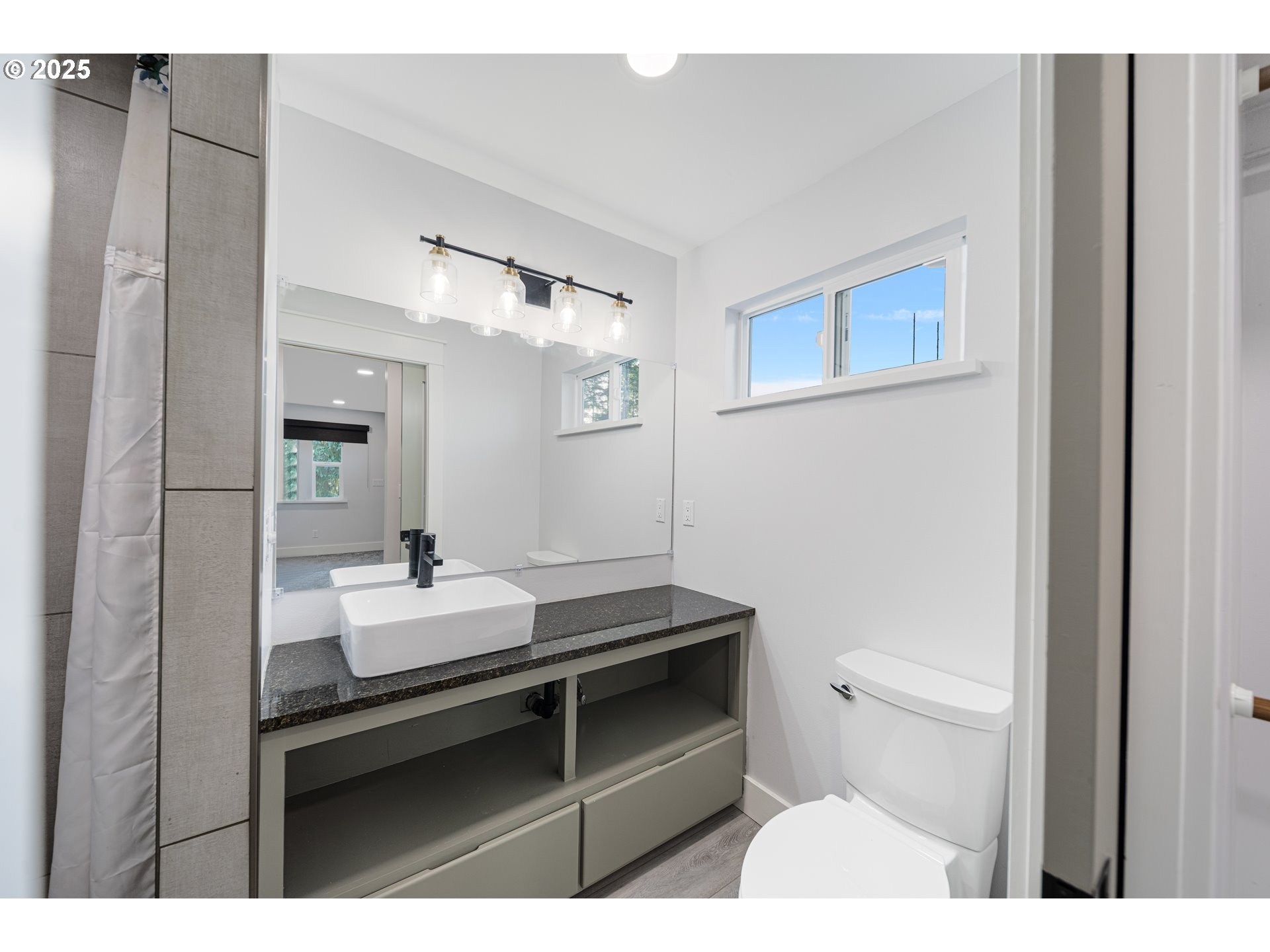 1955 28th Street Coos Bay, OR 97420 - Photo 29 of 48 a bathroom with a sink toilet and mirror