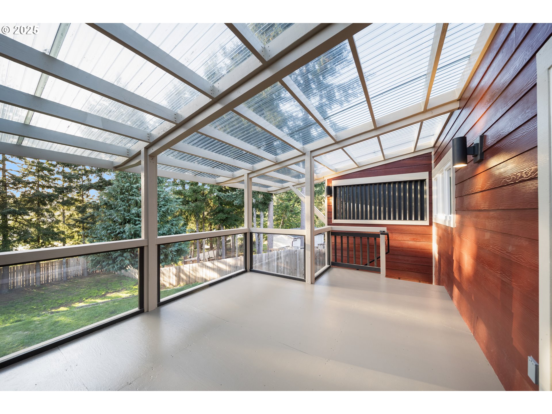 1955 28th Street Coos Bay, OR 97420 - Photo 31 of 48 a view of a porch with wooden floor and iron stairs
