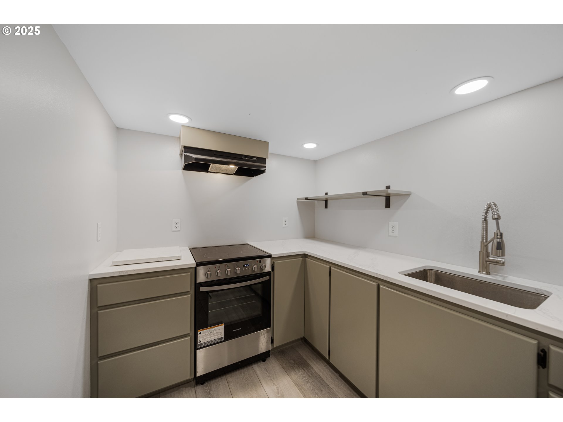 1955 28th Street Coos Bay, OR 97420 - Photo 38 of 48 a kitchen that has a sink and cabinets