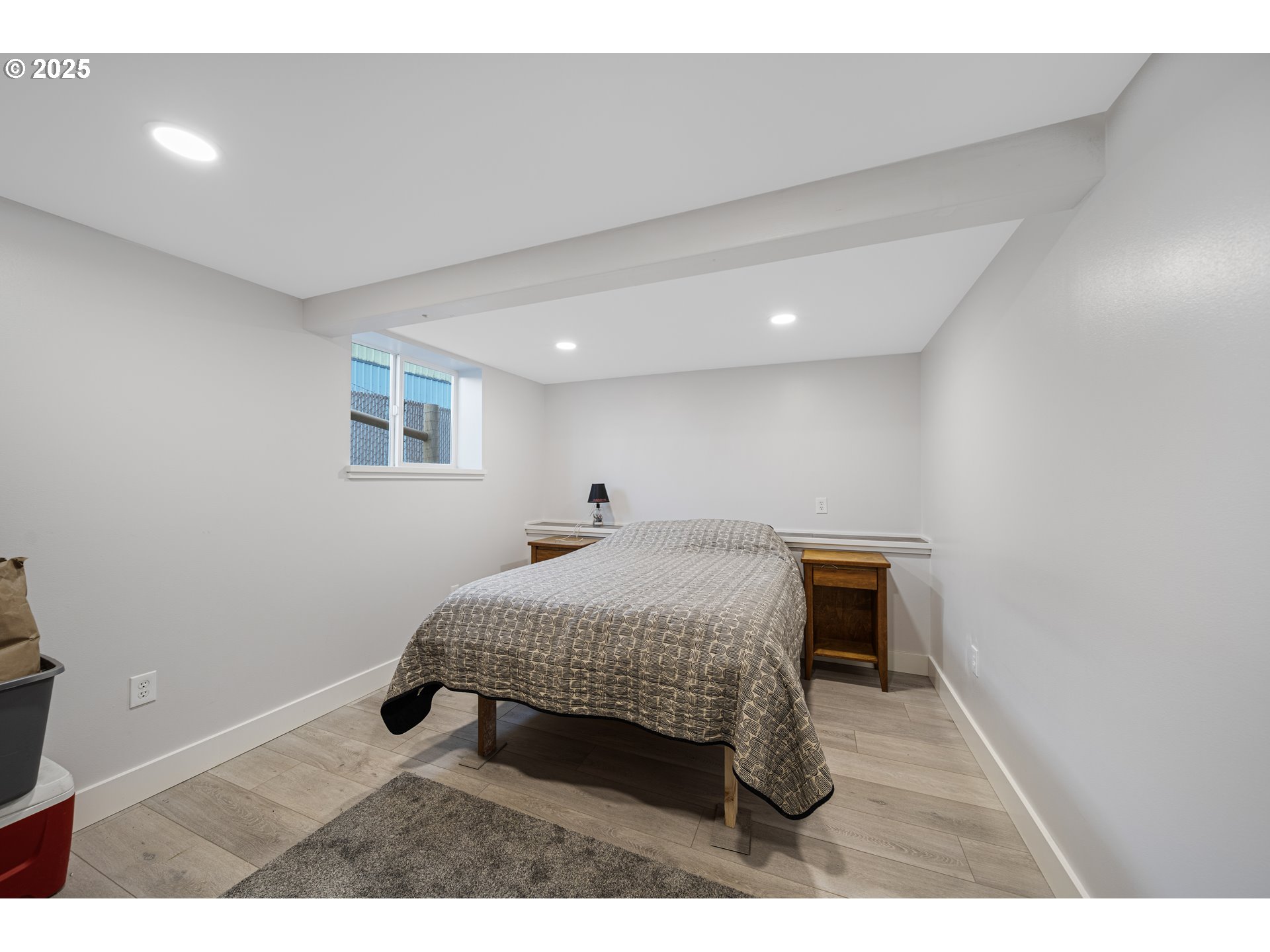 1955 28th Street Coos Bay, OR 97420 - Photo 41 of 48 a bedroom with a bed and a table