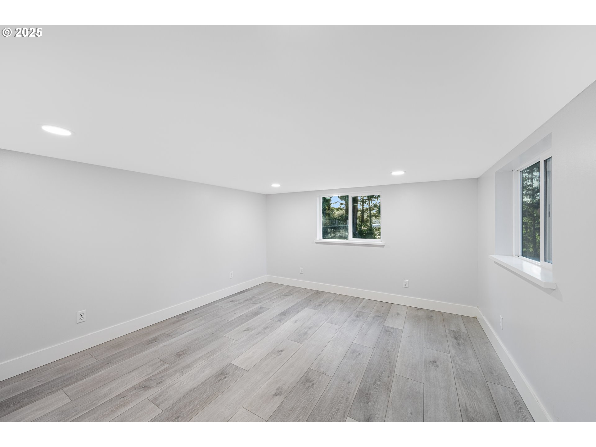 1955 28th Street Coos Bay, OR 97420 - Photo 44 of 48 a view of an empty room with wooden floor and a window