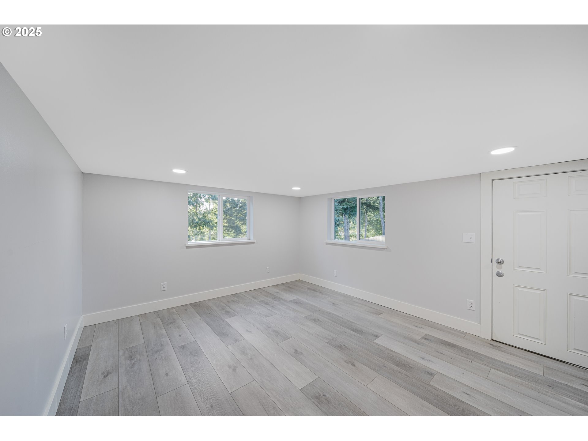 1955 28th Street Coos Bay, OR 97420 - Photo 45 of 48 an empty room with wooden floor and windows