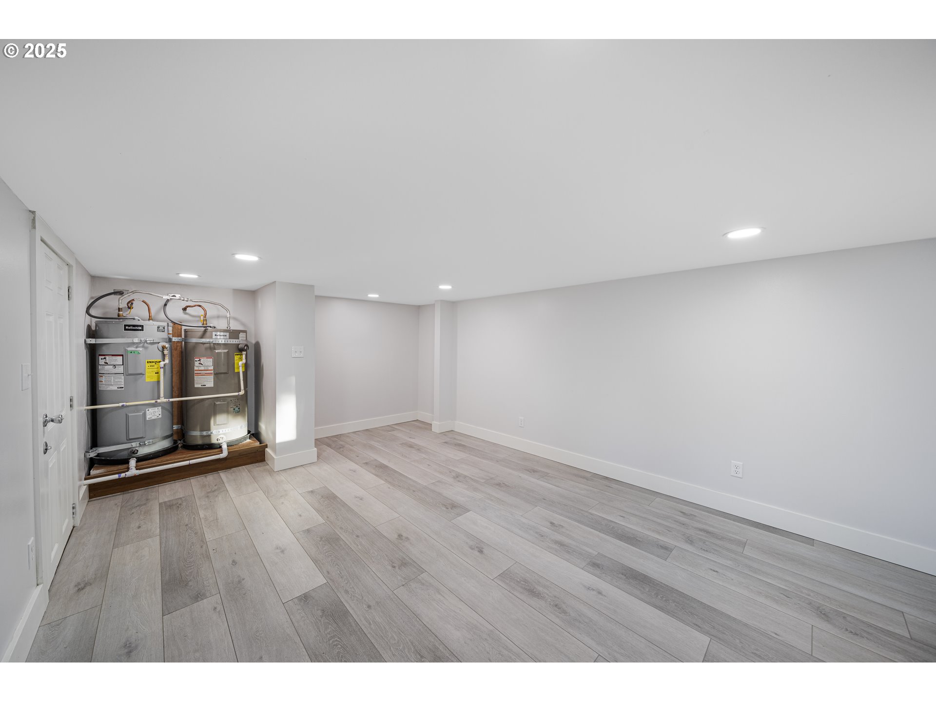 1955 28th Street Coos Bay, OR 97420 - Photo 46 of 48 a view of an empty room with wooden floor