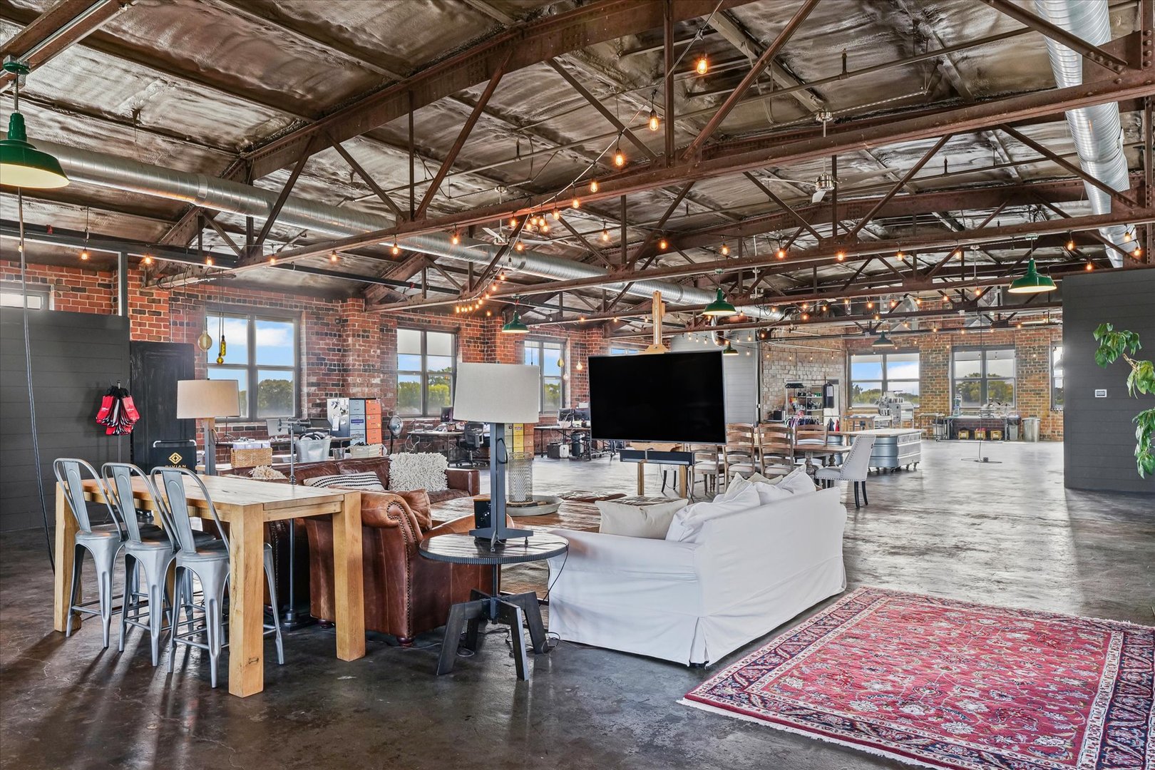 209 East Washington Street, Unit 5 Bloomington, IL 61701 - Photo 16 of 78 a living room with lots of furniture and a flat screen tv
