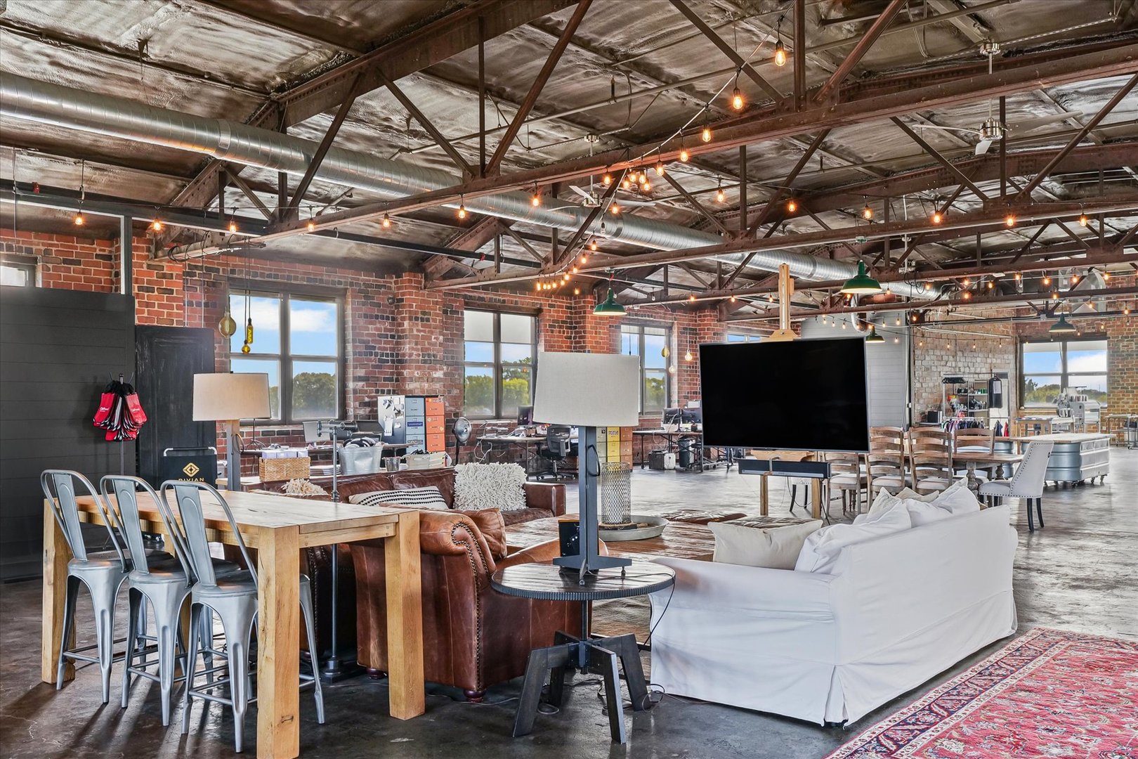 209 East Washington Street, Unit 5 Bloomington, IL 61701 - Photo 17 of 78 a living room with lots of furniture and a flat screen tv