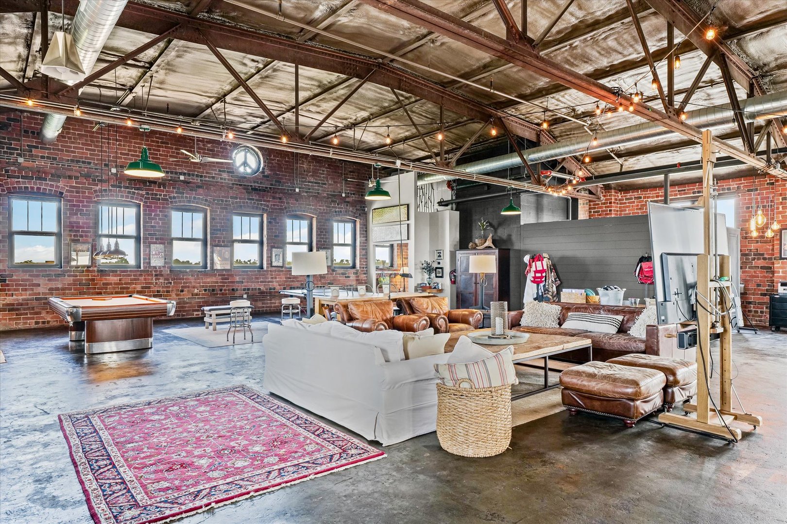 209 East Washington Street, Unit 5 Bloomington, IL 61701 - Photo 18 of 78 a living room with lots of furniture and a rug