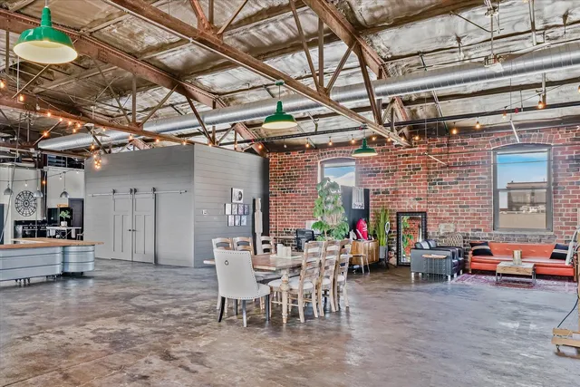 a kitchen with stainless steel appliances granite countertop a refrigerator and a stove