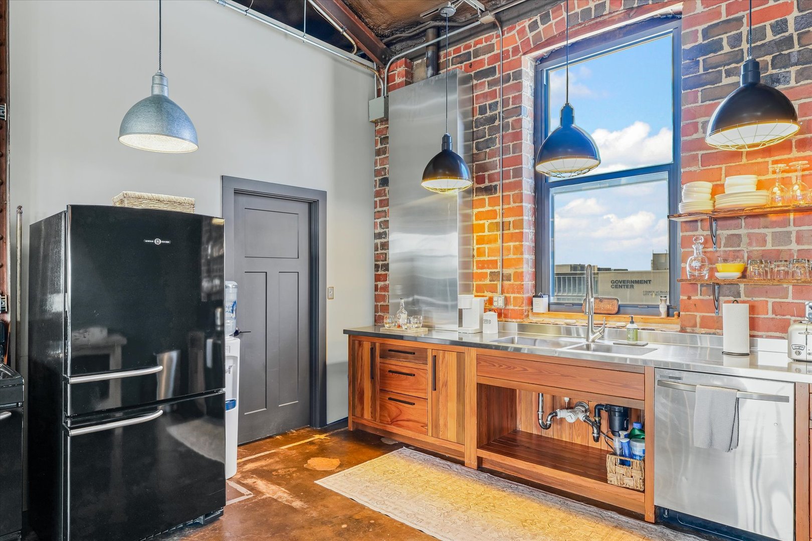 209 East Washington Street, Unit 5 Bloomington, IL 61701 - Photo 27 of 78 a kitchen with stainless steel appliances granite countertop a refrigerator and a stove