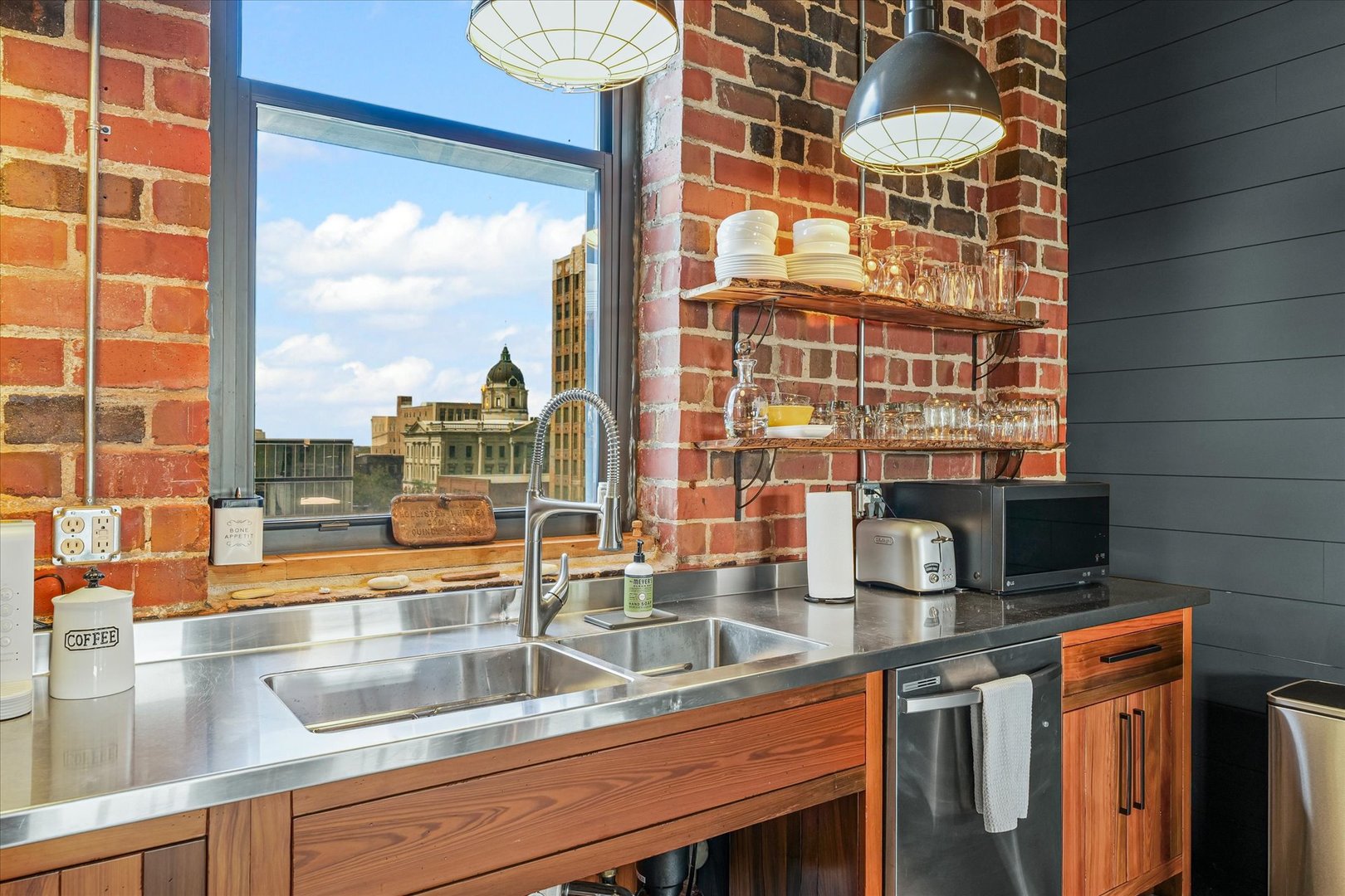 209 East Washington Street, Unit 5 Bloomington, IL 61701 - Photo 28 of 78 a kitchen with a sink and a large window