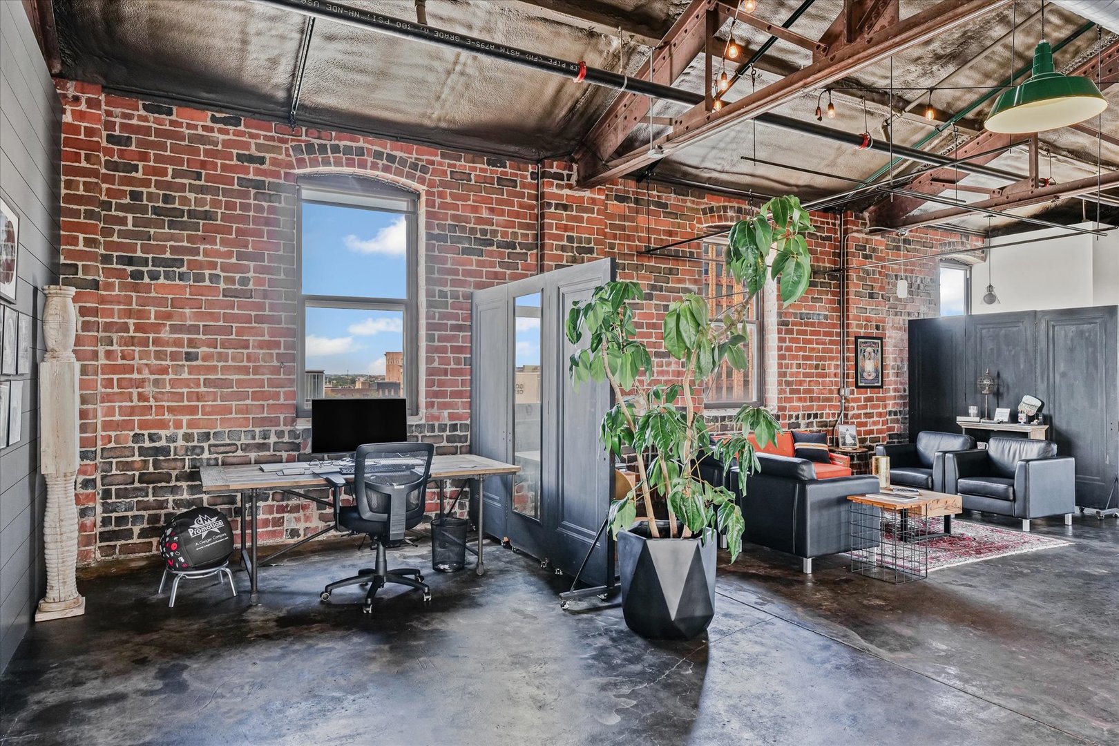 209 East Washington Street, Unit 5 Bloomington, IL 61701 - Photo 31 of 78 a building outdoor space with patio furniture and potted plants