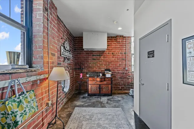 a view of a studio with wooden floor
