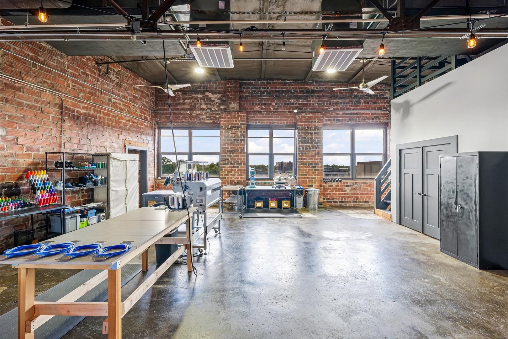 209 East Washington Street, Unit 5 Bloomington, IL 61701 - Photo 44 of 78 a view of a room with lots of wooden furniture and windows