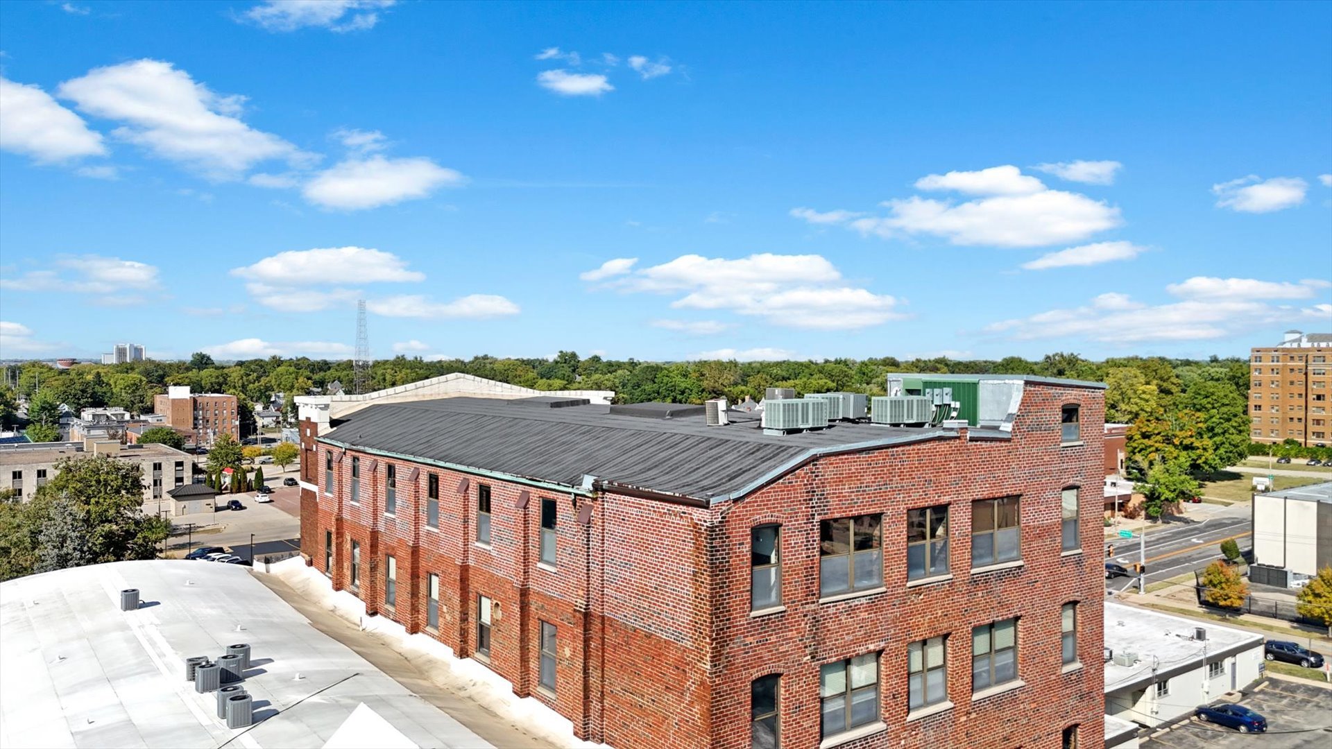 209 East Washington Street, Unit 5 Bloomington, IL 61701 - Photo 60 of 78 a view of a city with tall buildings