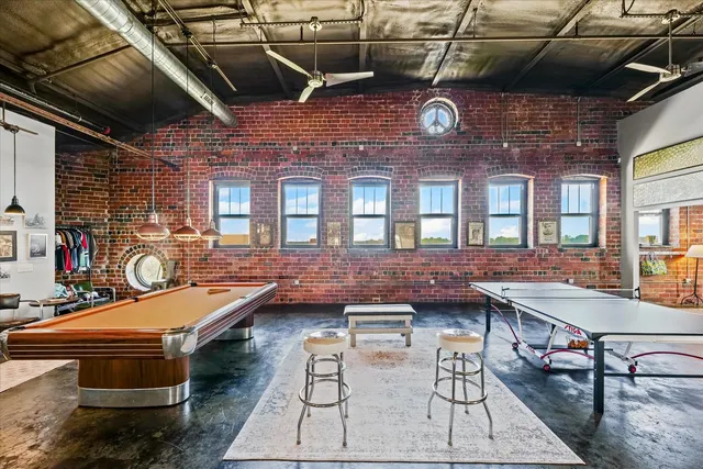 a living room with lots of furniture and a flat screen tv