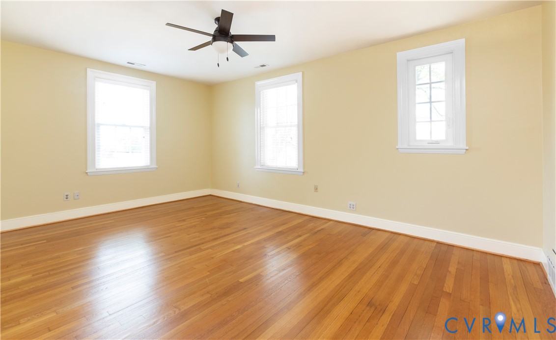 4801 Brook Road Richmond, VA 23227 - Photo 15 of 28 a view of empty room with wooden floor and fan
